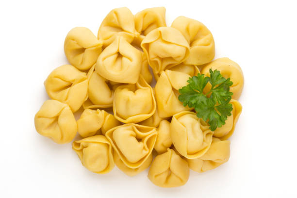 istock Raw homemade pasta,tortellini with herbs. 1369108705