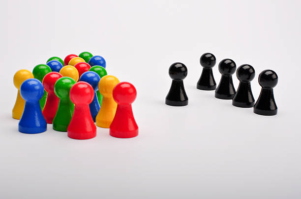 istock Black versus colorful group of figurines 136910946