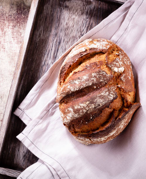 istock Sliced rye bread on cutting board, closeup.. 1369109534