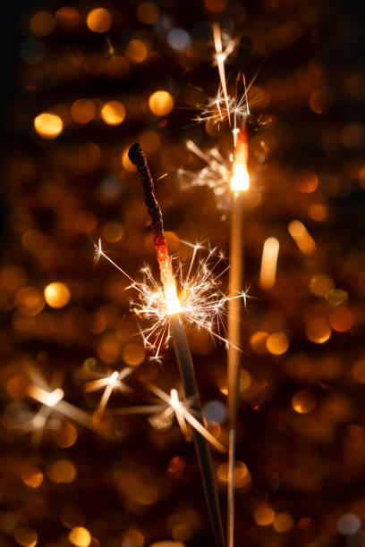istock Christmas bengal fire sparkles against the black background. 1369110918