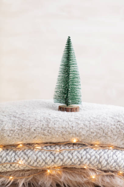 istock Christmas little trees and golden lights bokeh. 1369111073