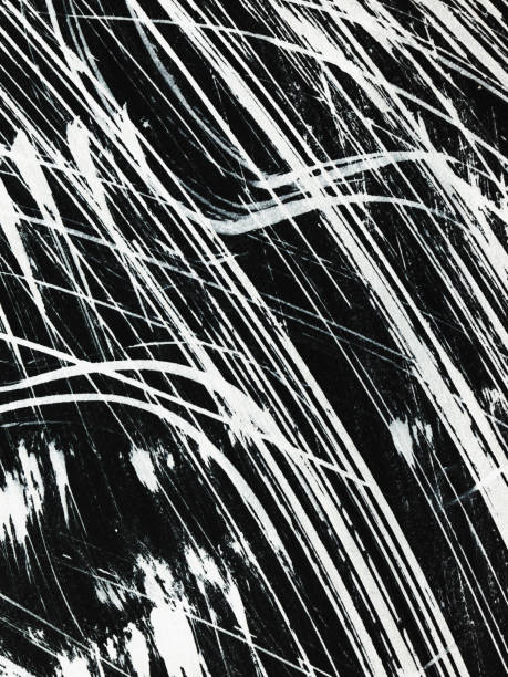 istock Patterns of white paint from a brush on a black background 1369112942