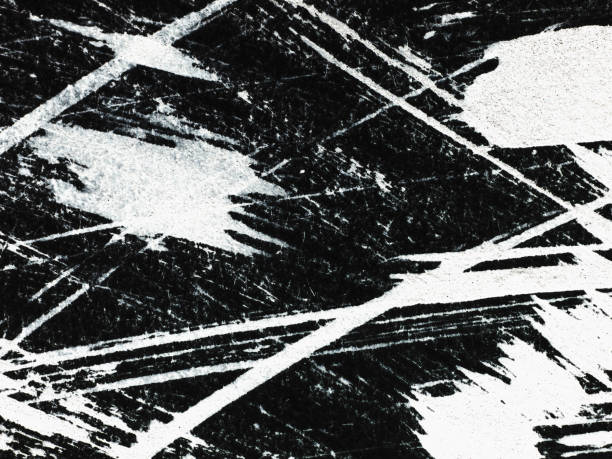 istock Patterns of white paint from a brush on a black background 1369113086