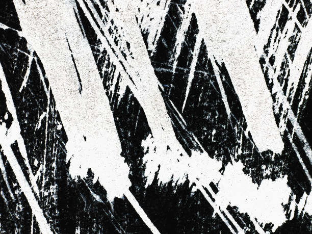 istock Patterns of white paint from a brush on a black background 1369114069