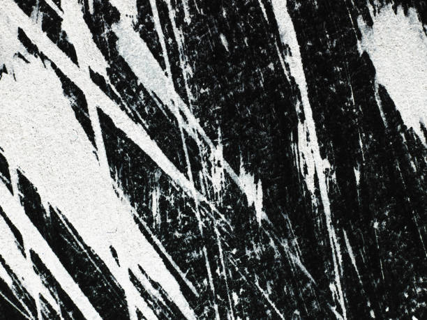 istock Patterns of white paint from a brush on a black background 1369114098