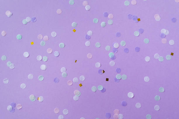 istock purple background with scattered confetti. mockup for party 1369114145