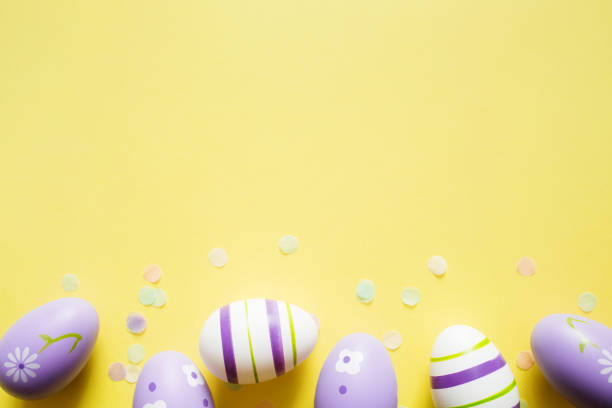 istock painted easter purple eggs with ornament and decor on yellow light pastel background with copy space 1369114147