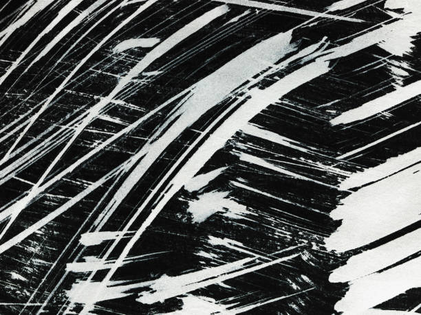 istock Patterns of white paint from a brush on a black background 1369115862
