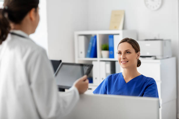 istock doctor with tablet computer and nurse at hospital 1369118687