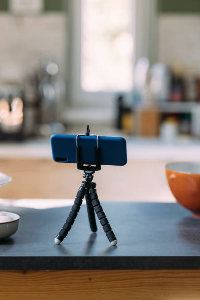 istock Pastry Chef's Vlog: A Smartphone on a Tripod Stand on the Kitchen Countertop 1369119046
