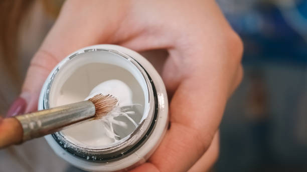 istock Preparing paints and brush for painting. 1369119414