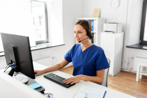 doctor with headset and computer at hospital stock photo
