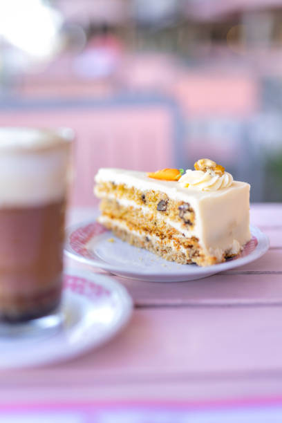 istock Carrot cake with cappucino coffee on restaurant table in the morning 1369120539