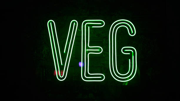 istock neon glowing inscription on the wall VEG 1369120567