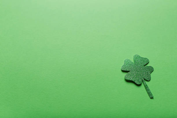 istock St. patrick's day. green background with clover leave four-leafed. copy space. Paper craft 1369121048