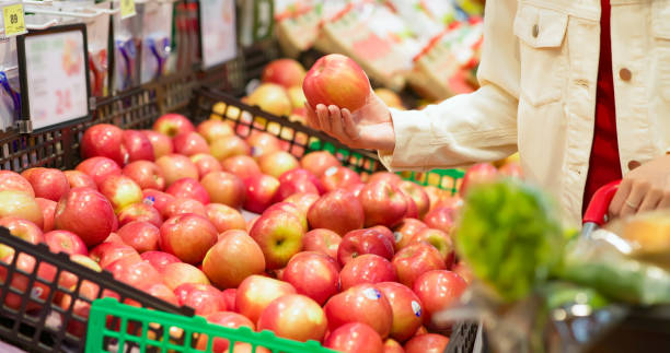 istock woman choose apple 1369121188