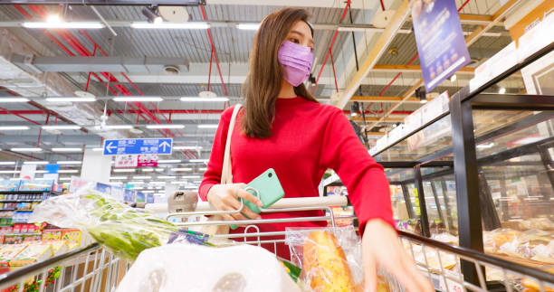 istock woman walk in produce section 1369121903