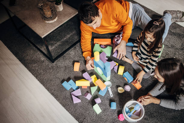 istock Family playing at home 1369122340