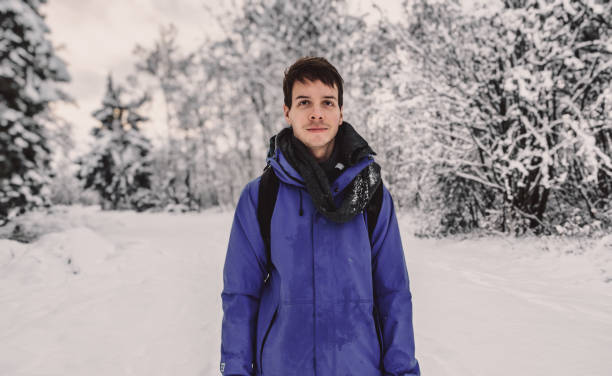 istock Young adult man hiking during winter 1369122361