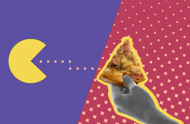 istock A hand holds a piece of pizza on a pink background.Pacman eats pizza. Digital collage modern art. 1369123830