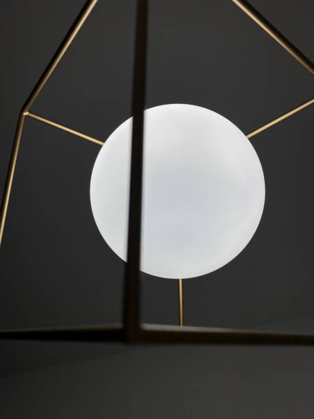 istock White round ceiling lamp with gold metal frame. 1369127242
