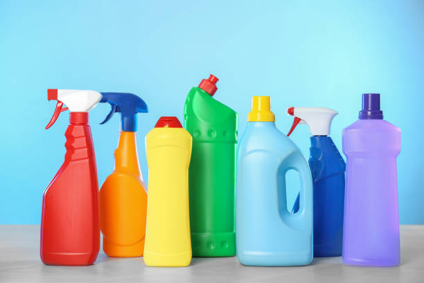 istock Bottles of different cleaning products on light table 1369127528