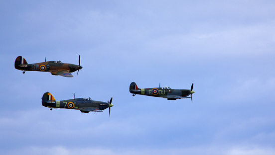 Ickwell, Bedfordshire, England - September 01, 2019: A Supermarine Spitfire, Hawker Hurricane and Hawker Sea Hurricane, flying together