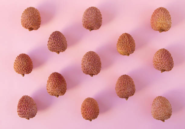 istock Lychee fruits on the pink background 1369132486