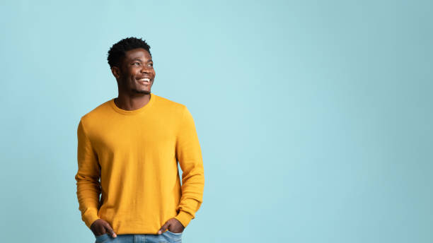 istock Happy black man in casual looking at copy space 1369133097