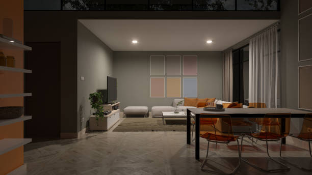 istock Illuminated Open Plan Living Room Behind the Dining Table at Night 1369134537