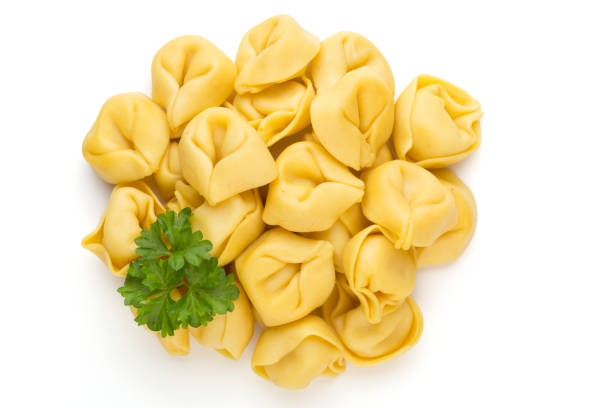 istock Raw homemade pasta,tortellini with herbs. 1369136359