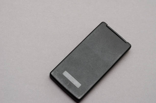 istock Closed Scientific calculator opposite the gray background. 1369136512