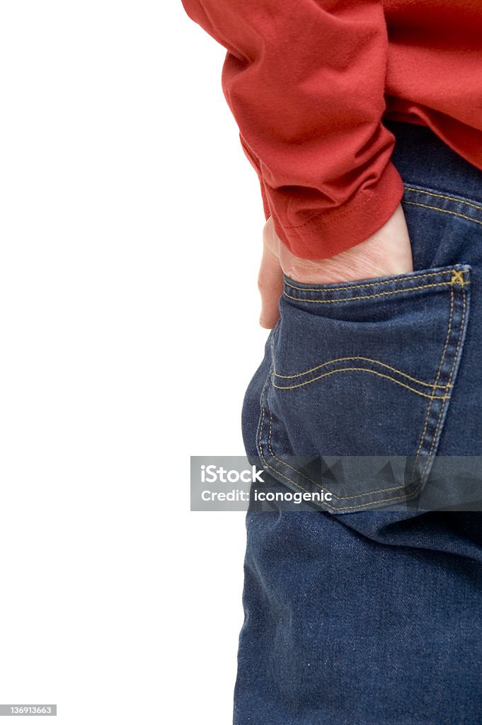 Hand In Pocket Dutch man, age 38, standing with his back to the camera in blue jeans and red shirt, holding one hand in a pocket. Adult Stock Photo