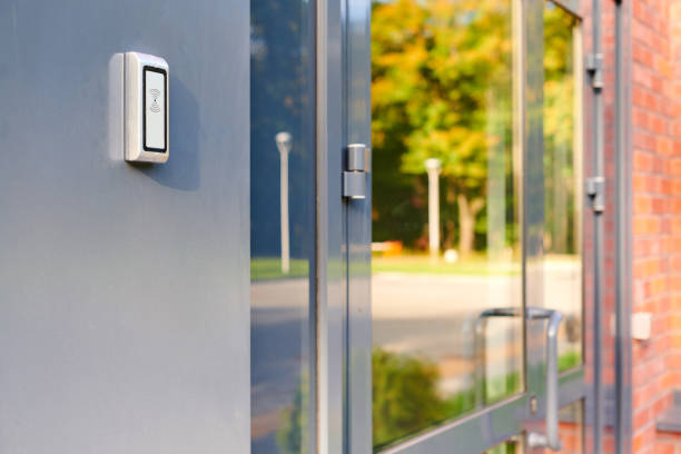 istock RFID reader by office door, employees only access by RFID key card, lock and key control system 1369136731