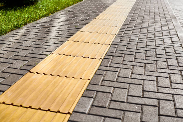 istock Yellow tactile paving on walkway, tactile ground surface indicators for blind and visually impaired 1369136749