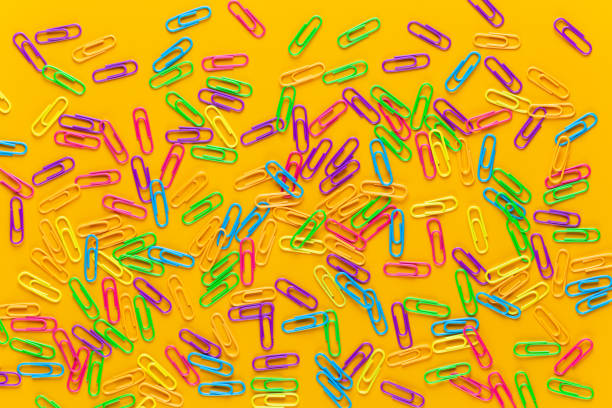 istock Paper color clip notebook on yellow background. Flat lay. 1369136852