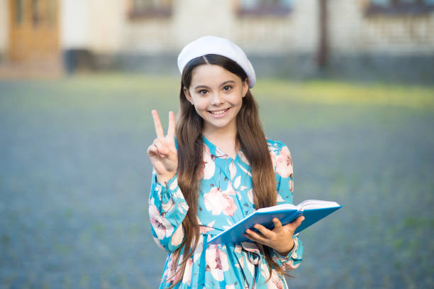 istock Girl student inspired reading recite poetry, having fun concept 1369137536