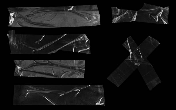 istock Transparent adhesive tapes isolated on black 1369138747