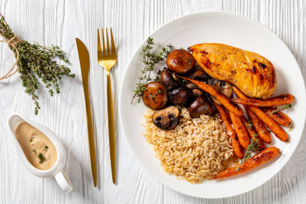istock Grilled chicken breast with rice, close-up 1369139523