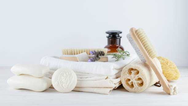 istock Natural soap bars and brushes on light background. 1369139853