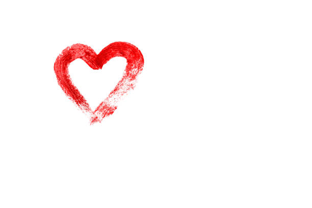 istock Heart symbol drawn with red lipstick on a white background. 1369140690