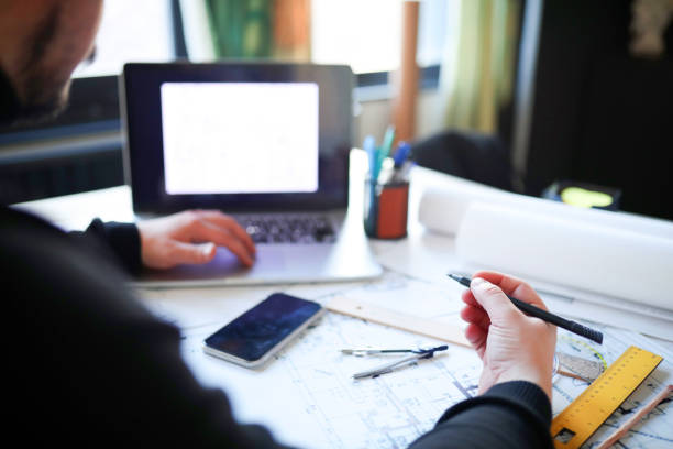 istock Modern Architect Businessman Produces Project in Design Office 1369140770