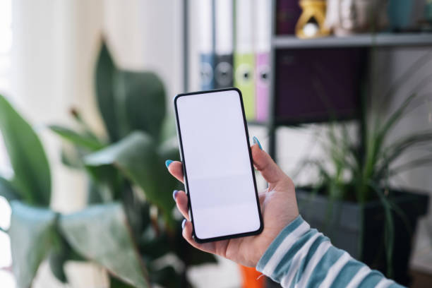 istock Female hand holding smart phone. 1369140978