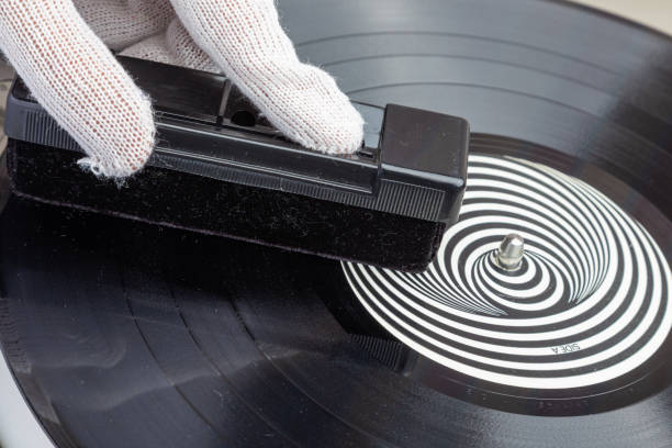 istock removing dust from the vinyl record using a velvet brush 1369141190