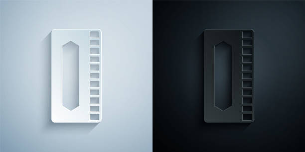 istock Paper cut Harmonica icon isolated on grey and black background. Musical instrument. Paper art style. Vector 1369141808