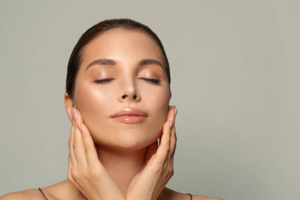 istock Young woman with beautiful face, eyes closed. 1369144257