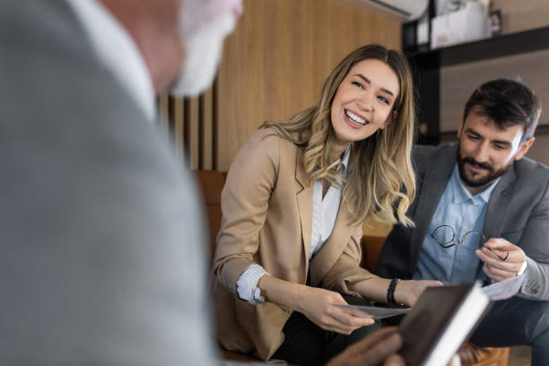 istock Young couple buying a car 1369144612