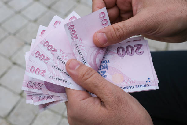 istock Man Counting 200 Turkish Banknot. 1369144734