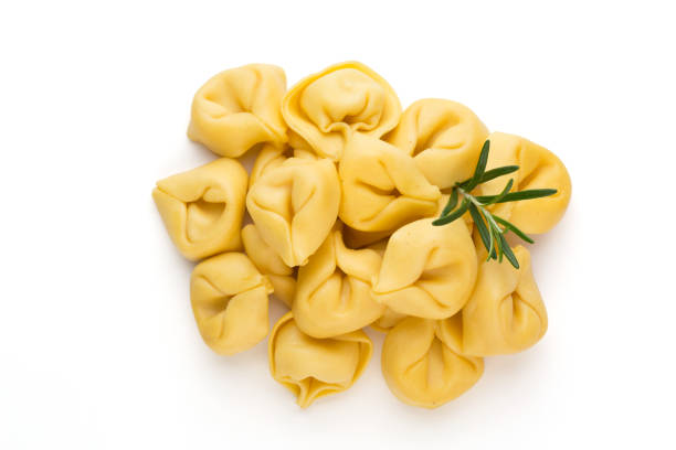 istock Raw homemade pasta,tortellini with herbs. 1369149633