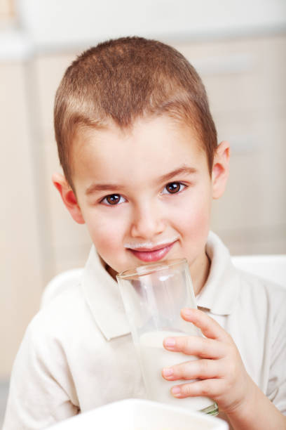 istock Little boy drink milk 1369149786